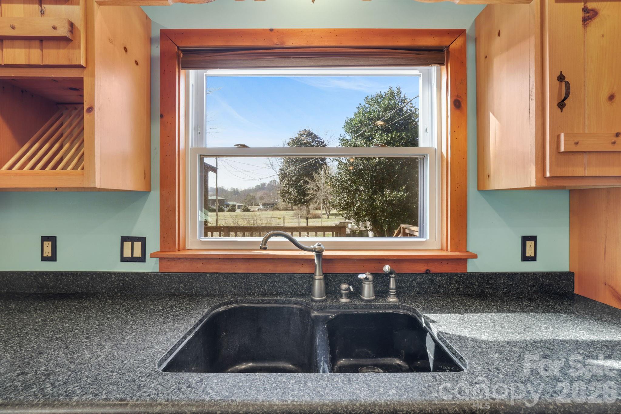 1644 West Deep Creek Road Bryson City, NC 28713 - Photo 10 of 47 a kitchen with a sink and a window