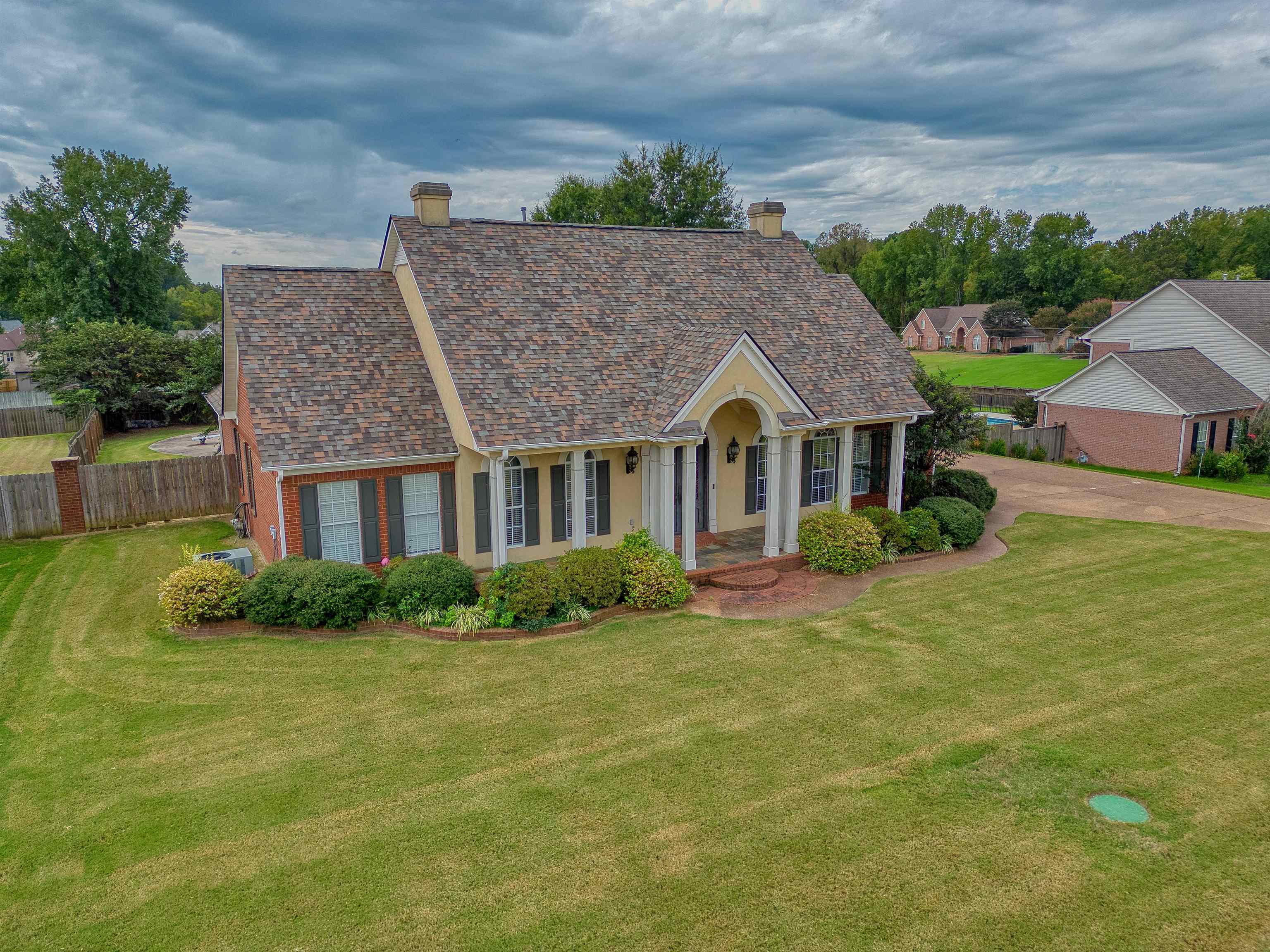 215 Walker Lake Road Atoka, TN 38004 - Photo 2 of 38 View of front facade with a garage and a front lawn