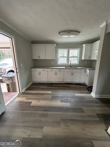 a bathroom with a sink and mirror