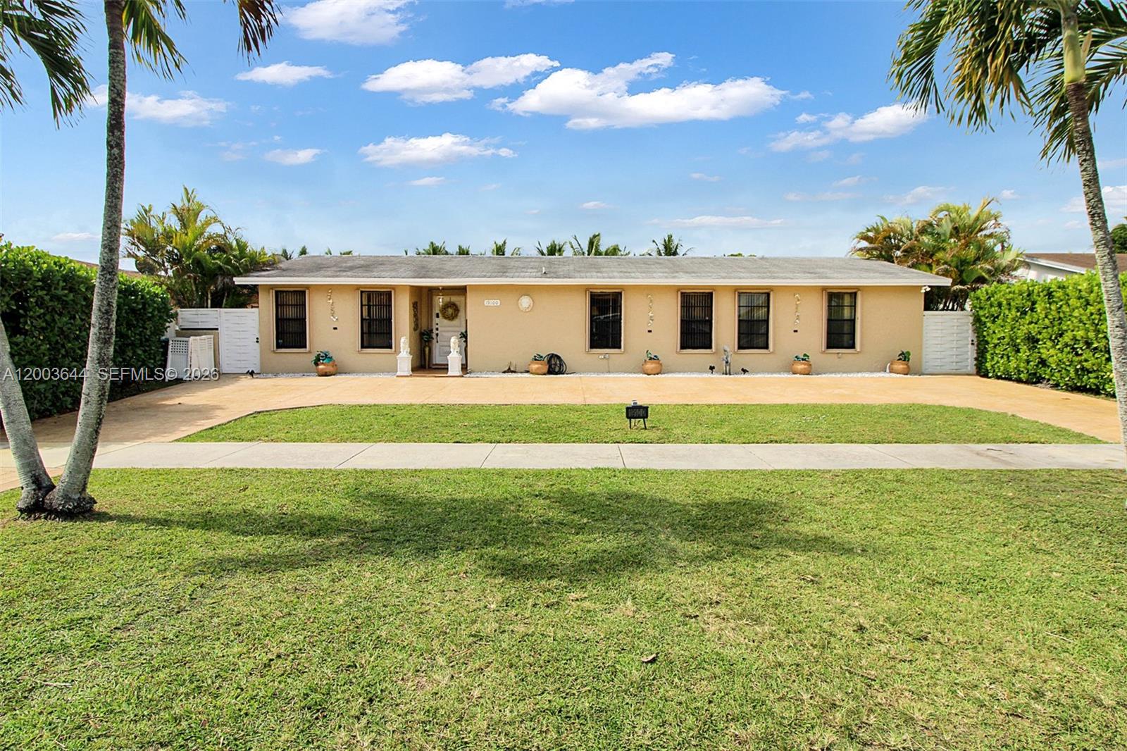 19100 Southwest 125th Avenue Miami, FL 33177 - Photo 1 of 46 a front view of house with yard outdoor seating and barbeque oven