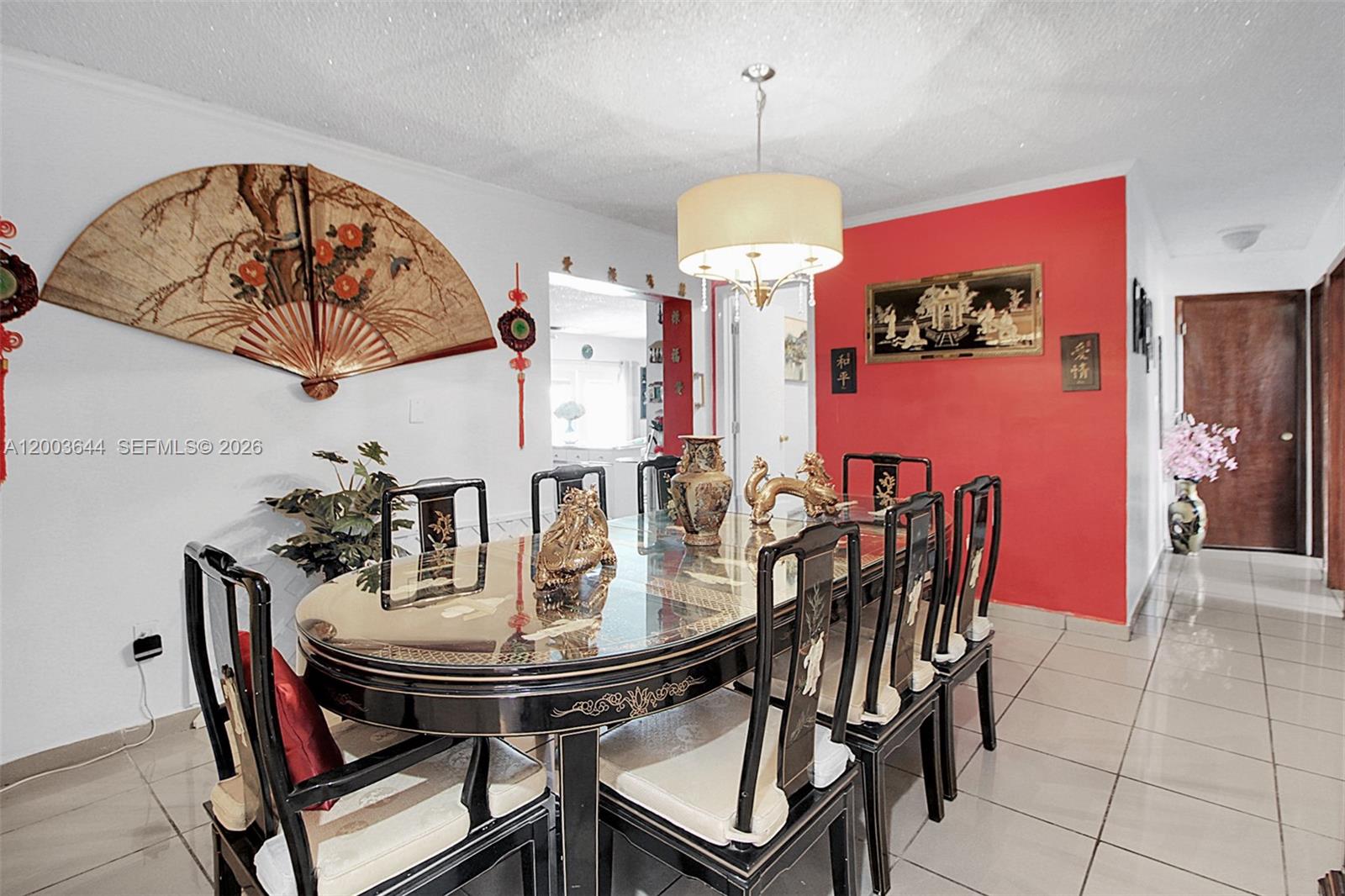 19100 Southwest 125th Avenue Miami, FL 33177 - Photo 12 of 46 a view of a dining room with furniture and a chandelier