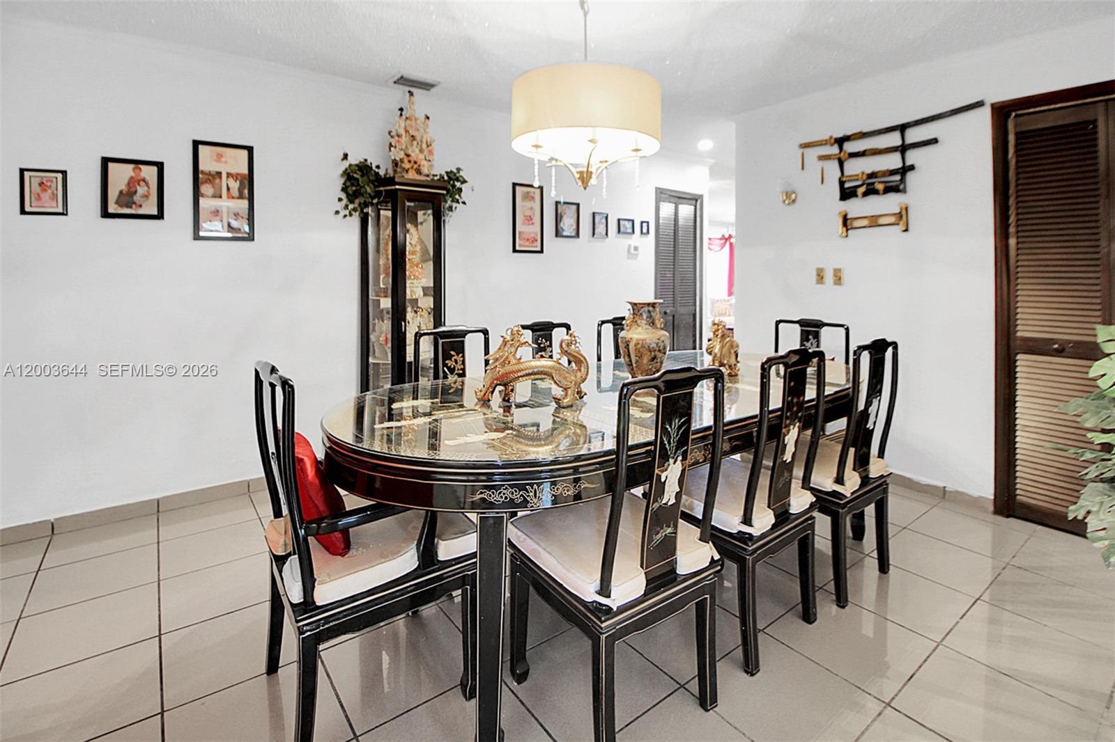 19100 Southwest 125th Avenue Miami, FL 33177 - Photo 13 of 46 a view of a dining room with furniture and wooden floor