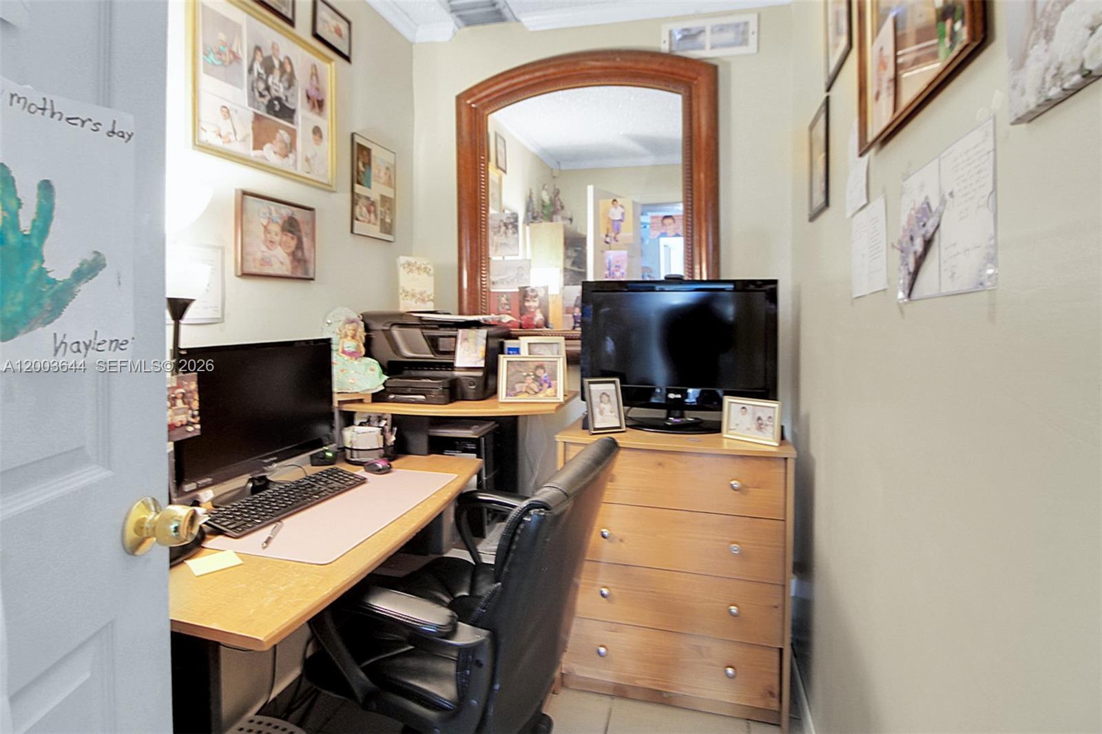19100 Southwest 125th Avenue Miami, FL 33177 - Photo 14 of 46 a view of a workspace with furniture and a flat screen tv