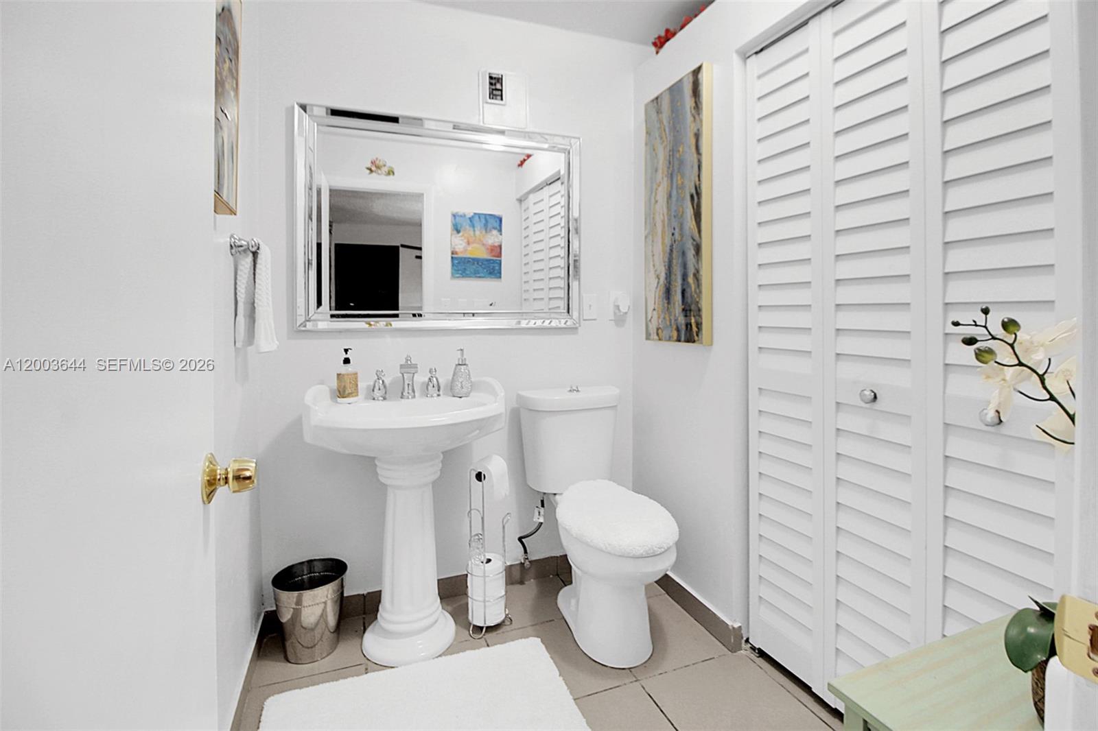 19100 Southwest 125th Avenue Miami, FL 33177 - Photo 15 of 46 a bathroom with a sink toilet a mirror and shower