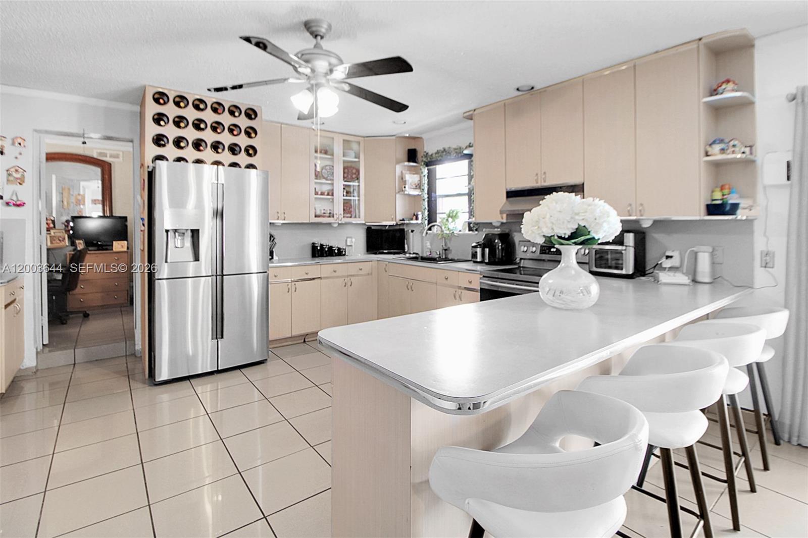 19100 Southwest 125th Avenue Miami, FL 33177 - Photo 17 of 46 a kitchen with stainless steel appliances granite countertop a refrigerator and microwave