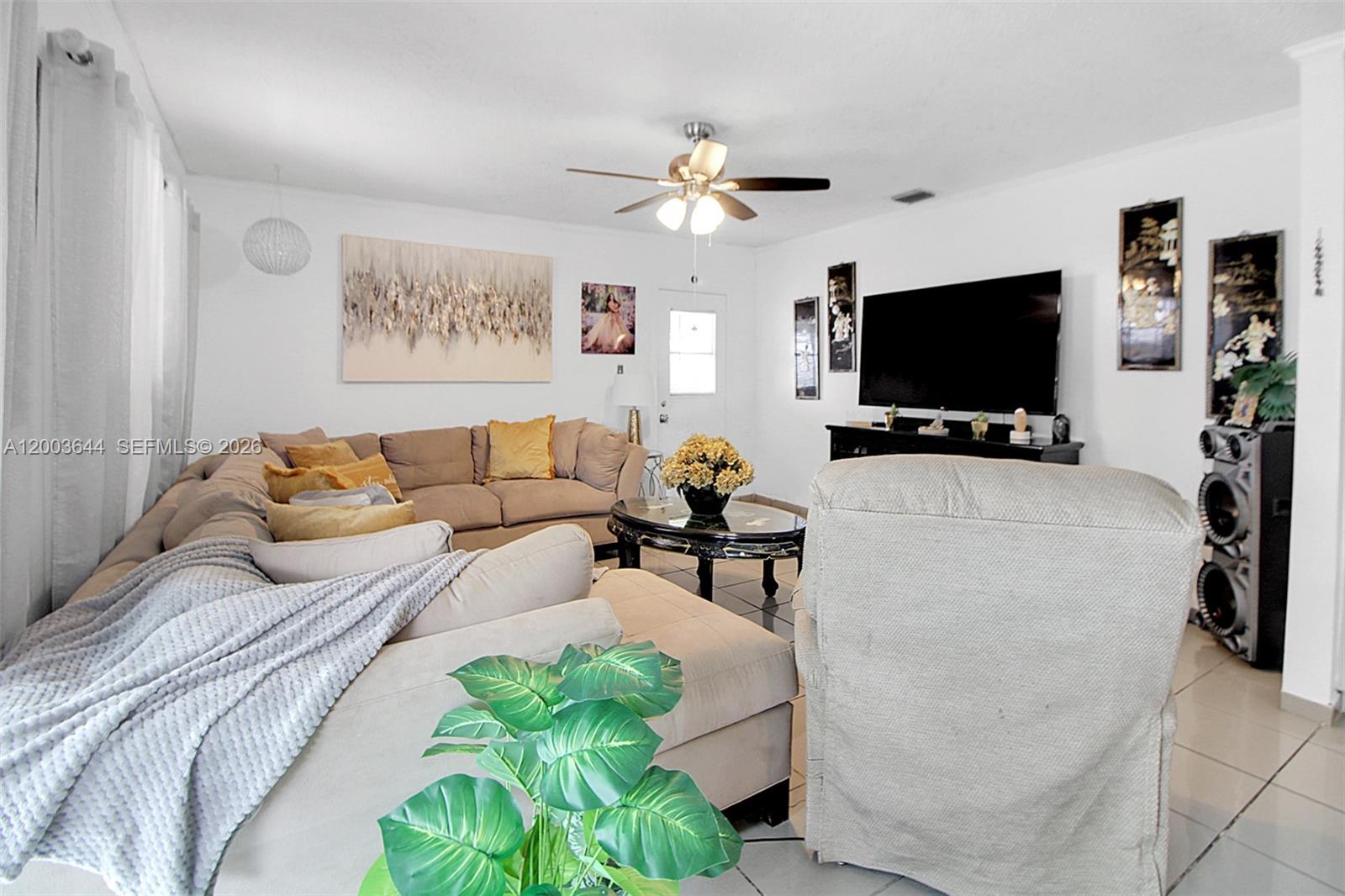 19100 Southwest 125th Avenue Miami, FL 33177 - Photo 19 of 46 a living room with furniture and a flat screen tv