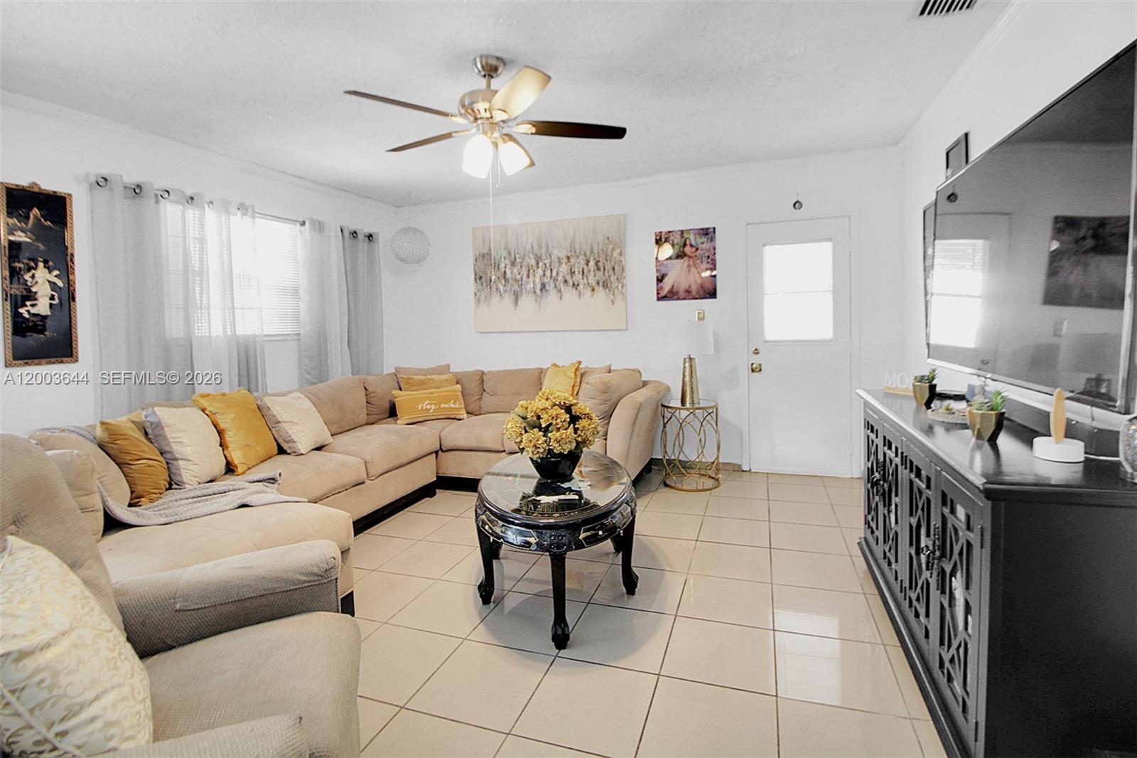 19100 Southwest 125th Avenue Miami, FL 33177 - Photo 20 of 46 a living room with furniture a couch and a window