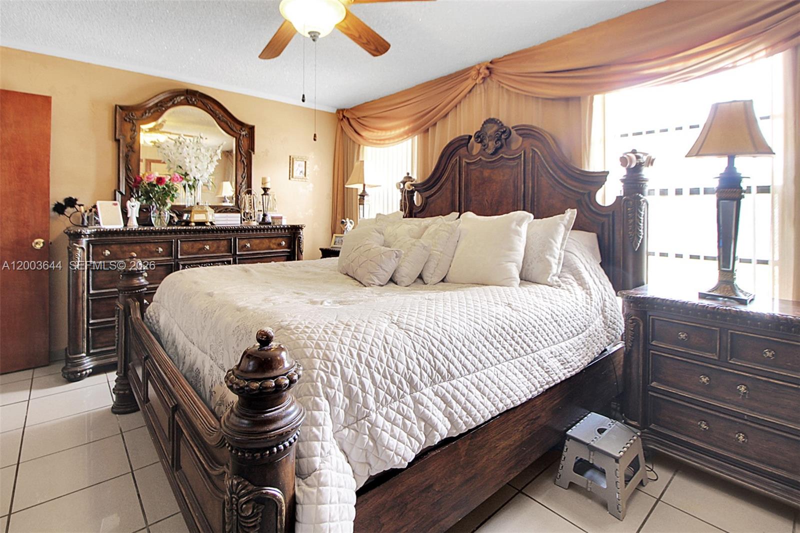 19100 Southwest 125th Avenue Miami, FL 33177 - Photo 25 of 46 a bedroom with a bed and a large window