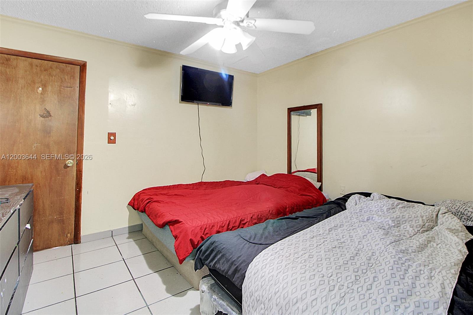 19100 Southwest 125th Avenue Miami, FL 33177 - Photo 29 of 46 a bedroom with a bed and a flat screen tv