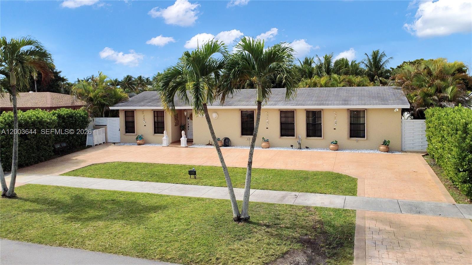19100 Southwest 125th Avenue Miami, FL 33177 - Photo 4 of 46 a front view of a house with garden