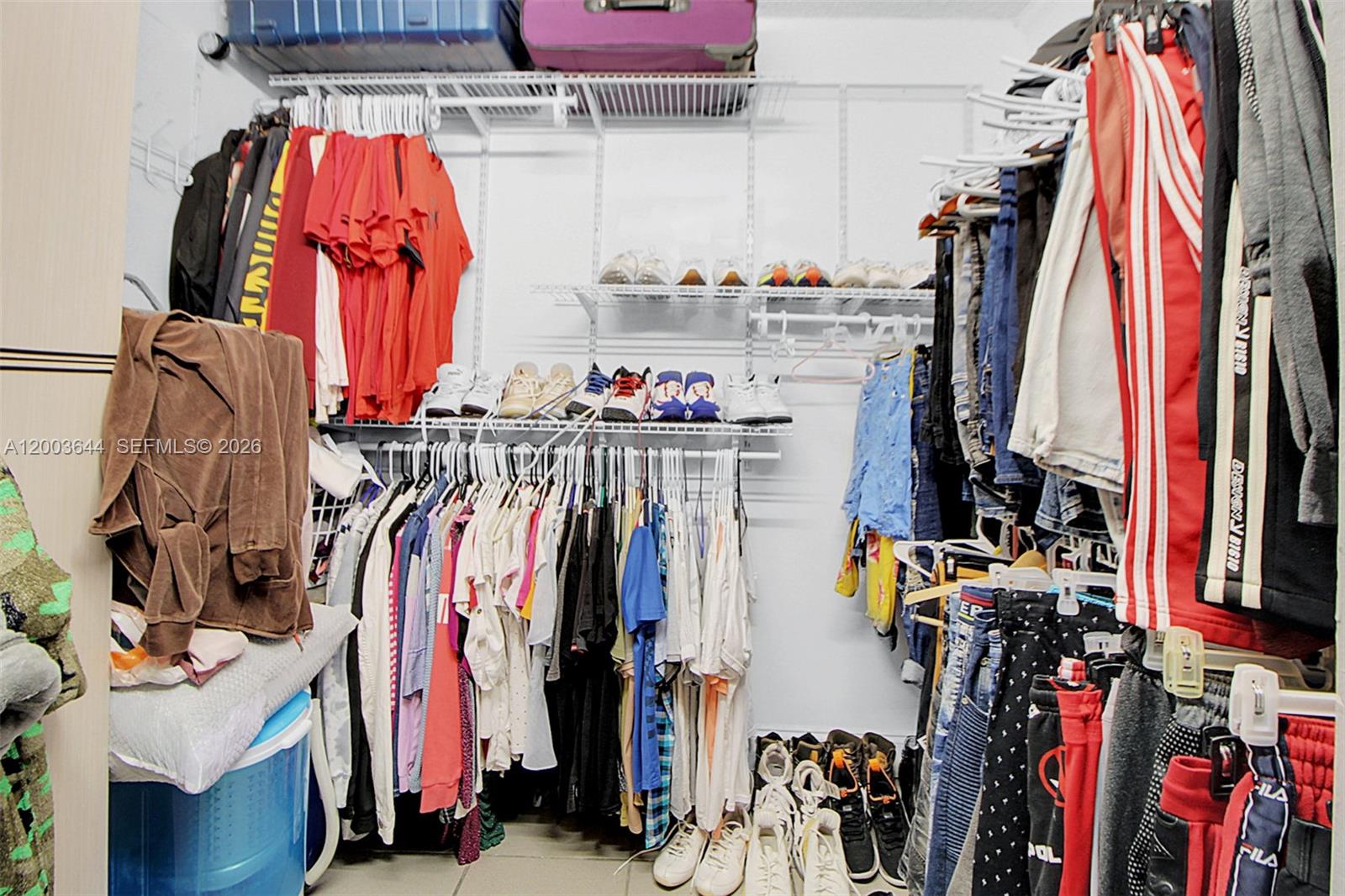 19100 Southwest 125th Avenue Miami, FL 33177 - Photo 45 of 46 a view of walk in closet with clothes