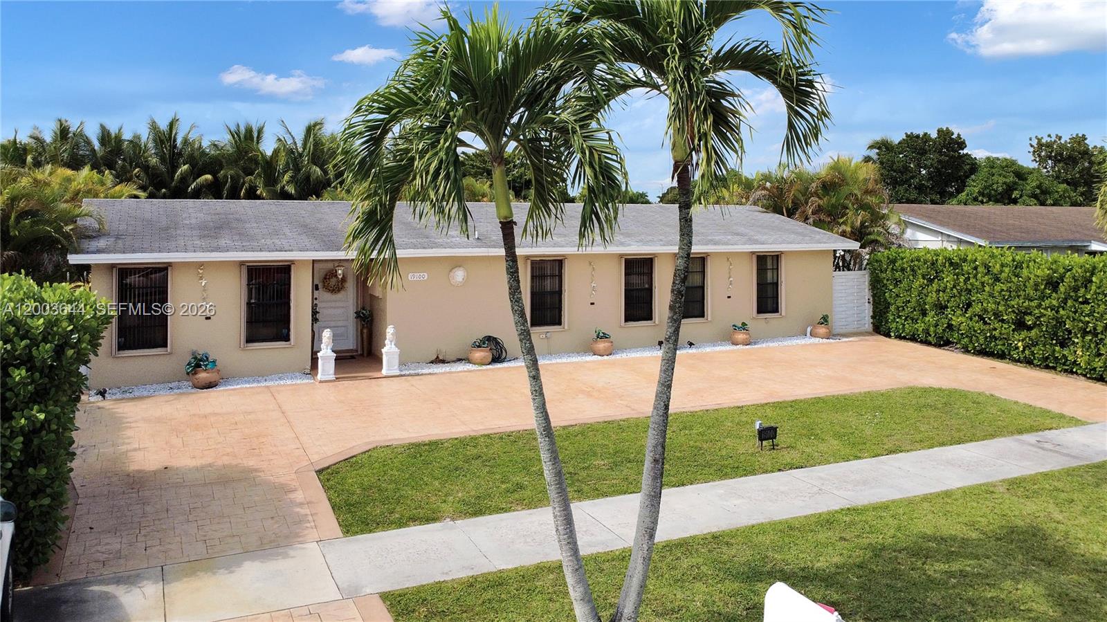 19100 Southwest 125th Avenue Miami, FL 33177 - Photo 5 of 46 a swimming pool with outdoor seating and yard