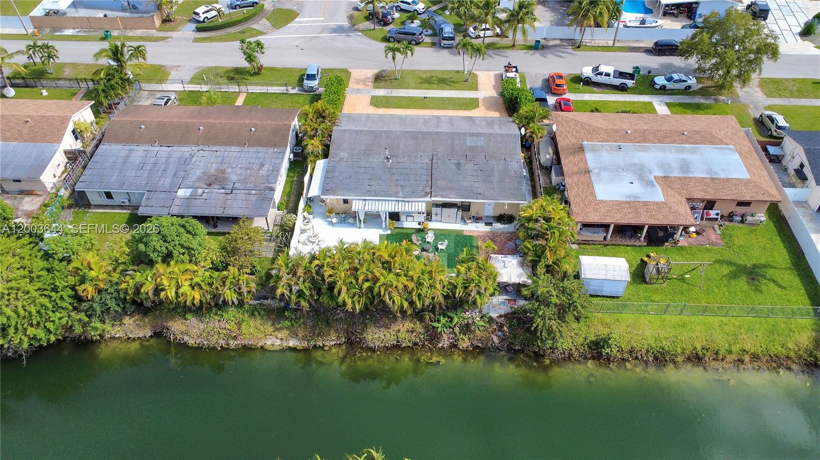19100 Southwest 125th Avenue Miami, FL 33177 - Photo 7 of 46 an aerial view of multiple houses with yard