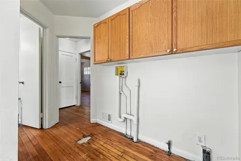a view of front door with wooden floor