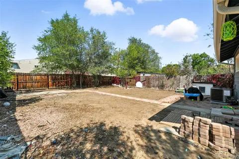 a backyard of a house with yard and outdoor seating