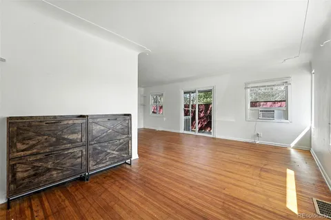 a view of a livingroom with wooden floor