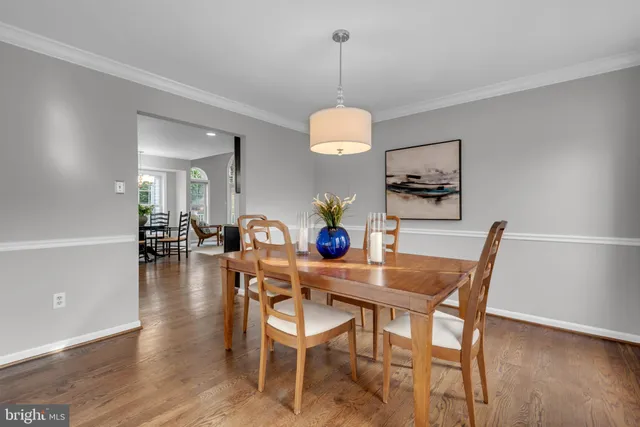 a dining room with furniture a livingroom and chandelier