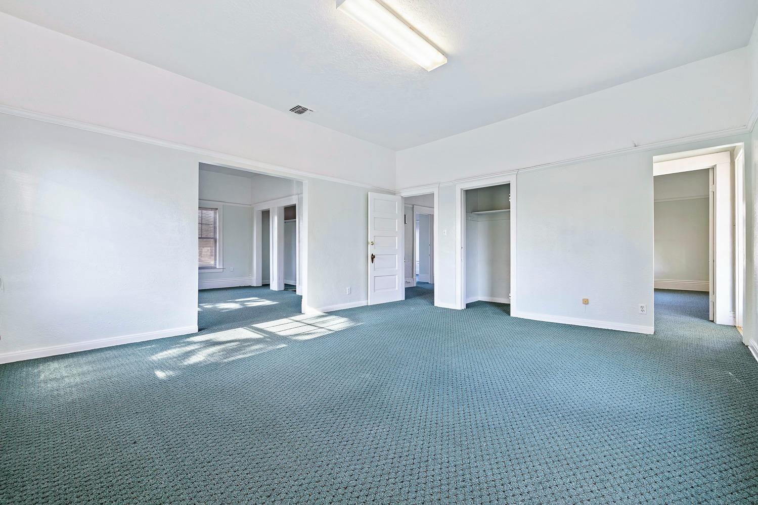 235 North Fulton Street Fresno, CA 93701 - Photo 22 of 43 a view of a big room with closet and windows