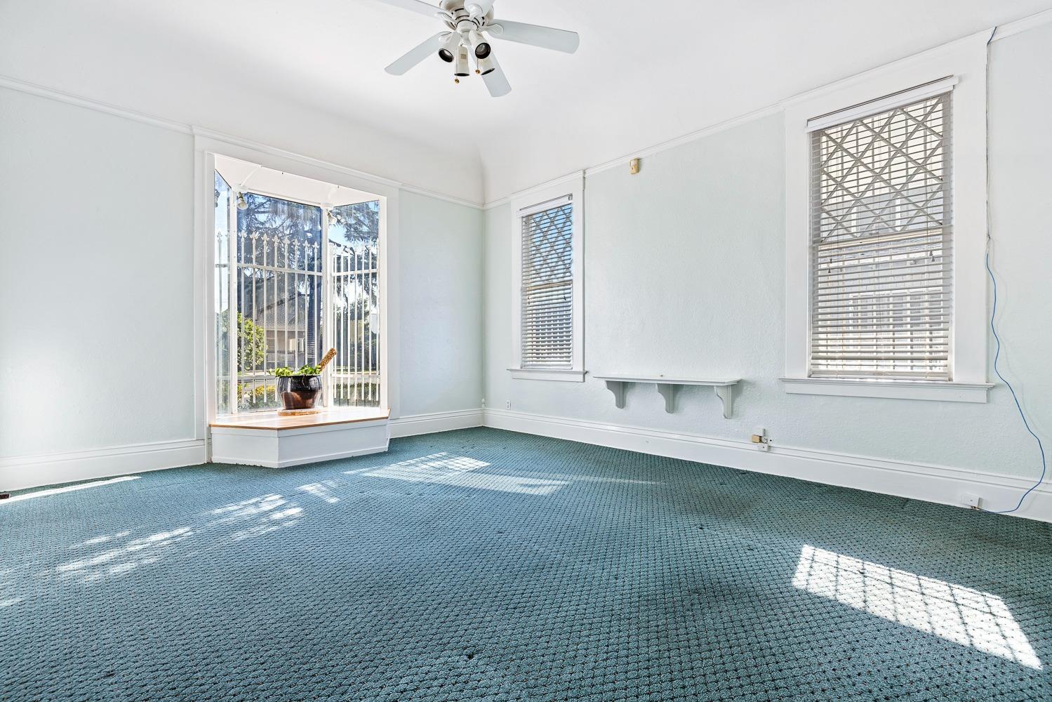 235 North Fulton Street Fresno, CA 93701 - Photo 3 of 43 a view of an empty room with a window