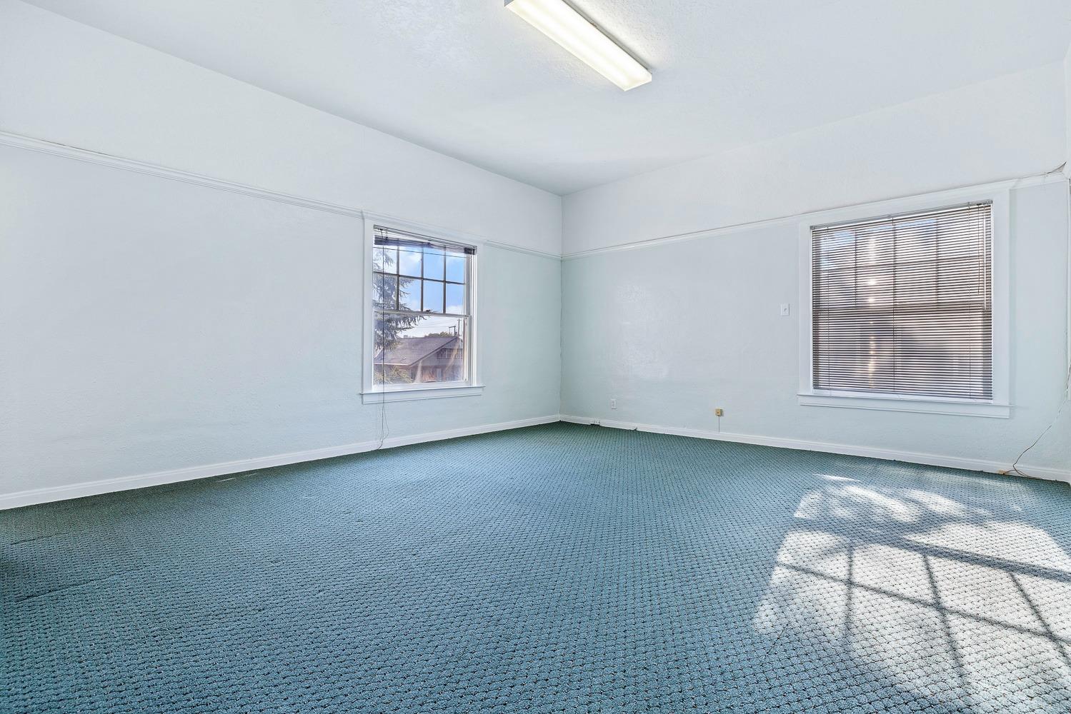 235 North Fulton Street Fresno, CA 93701 - Photo 40 of 43 an empty room with windows and closet