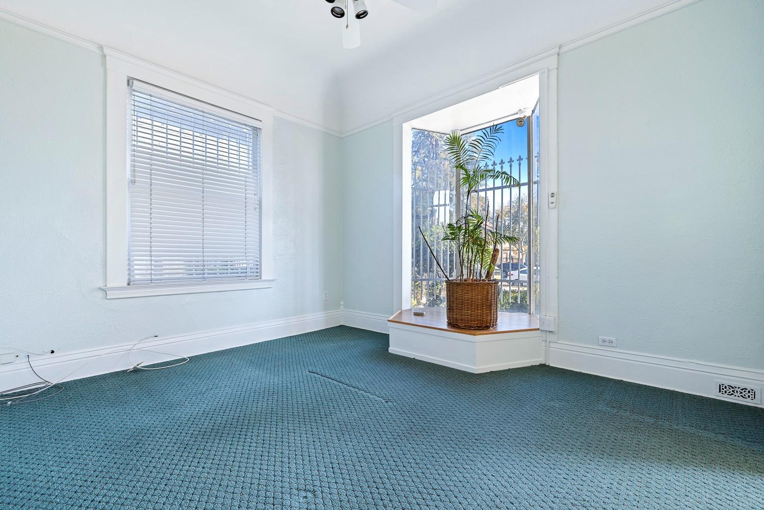 235 North Fulton Street Fresno, CA 93701 - Photo 6 of 43 a room with window and air conditioner vent