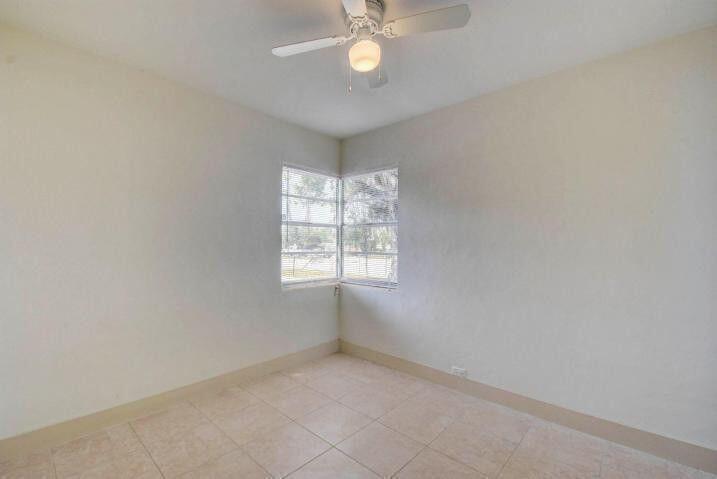 3000 Broadway Avenue, Unit 3 West Palm Beach, FL 33407 - Photo 11 of 19 an empty room with a window
