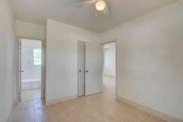 a view of an empty room and a window
