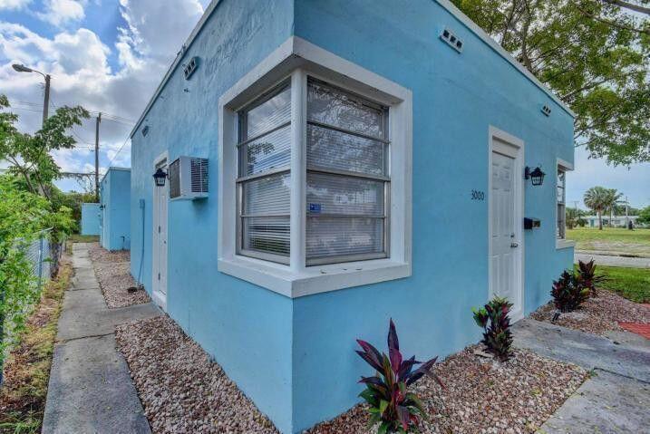 3000 Broadway Avenue, Unit 3 West Palm Beach, FL 33407 - Photo 3 of 19 a view of a house with a potted plant