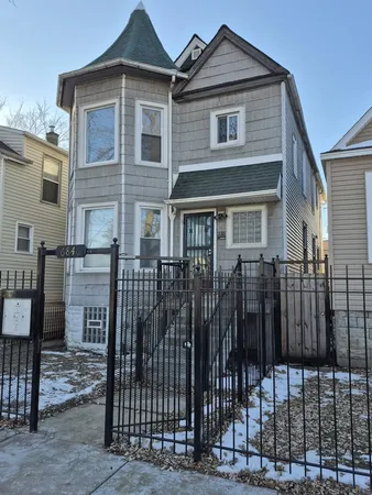 a front view of a house with parking area