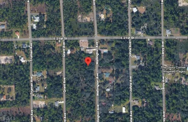 a view of a street with a yard