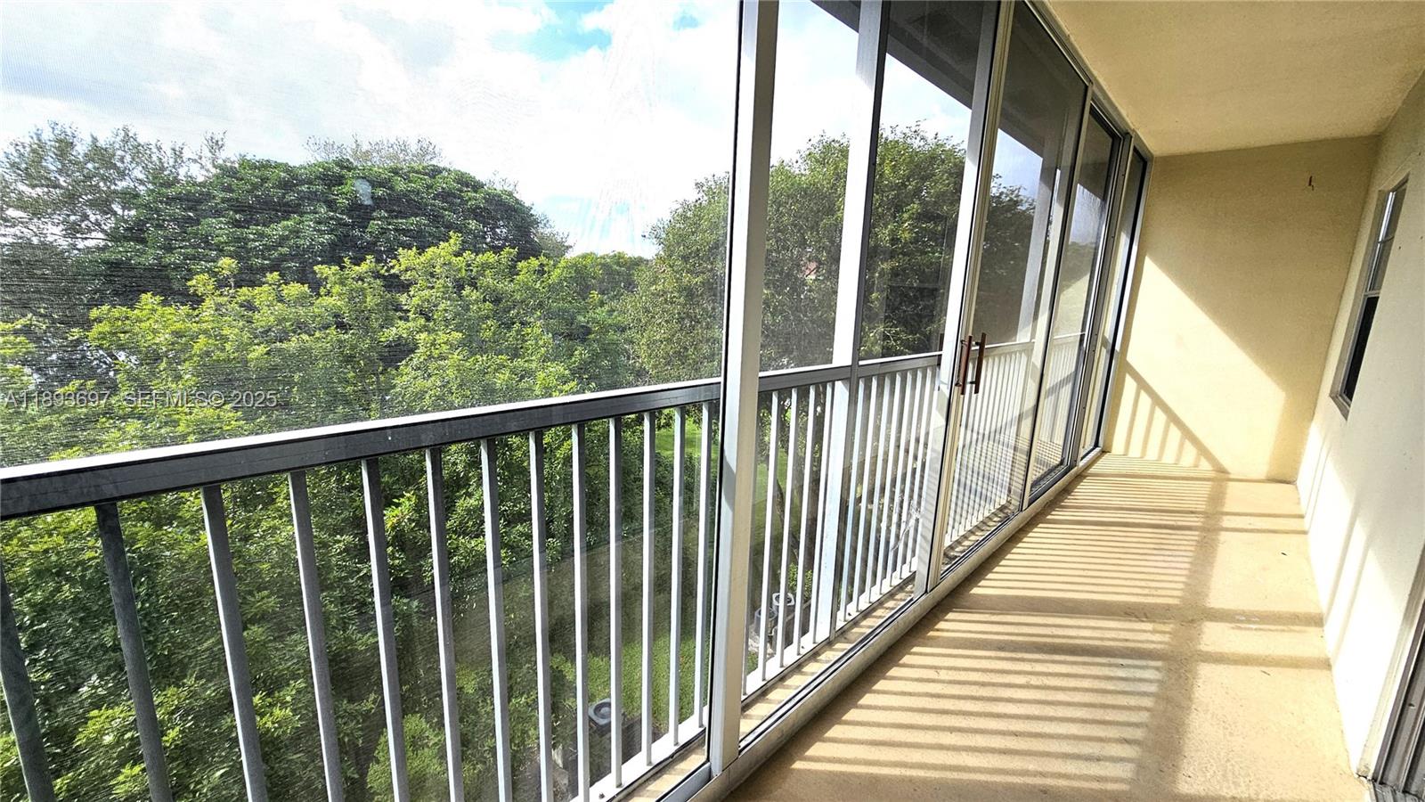 13450 Southwest 3rd Street, Unit 415D Pembroke Pines, FL 33027 - Photo 12 of 15 a view of balcony with wooden floor