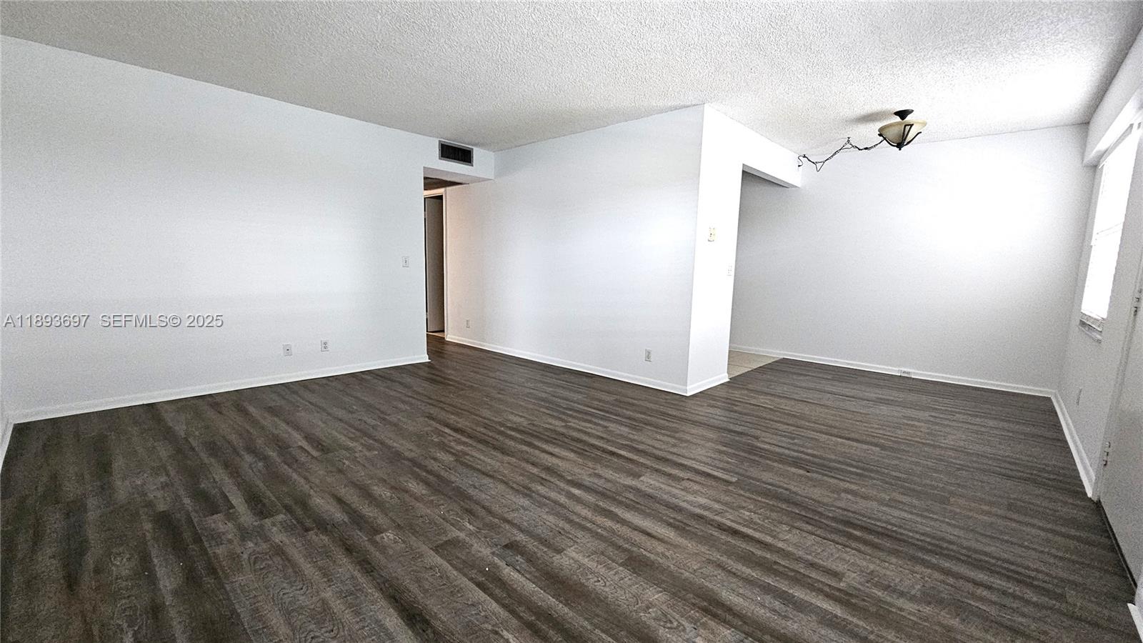13450 Southwest 3rd Street, Unit 415D Pembroke Pines, FL 33027 - Photo 2 of 15 wooden floor in an empty room