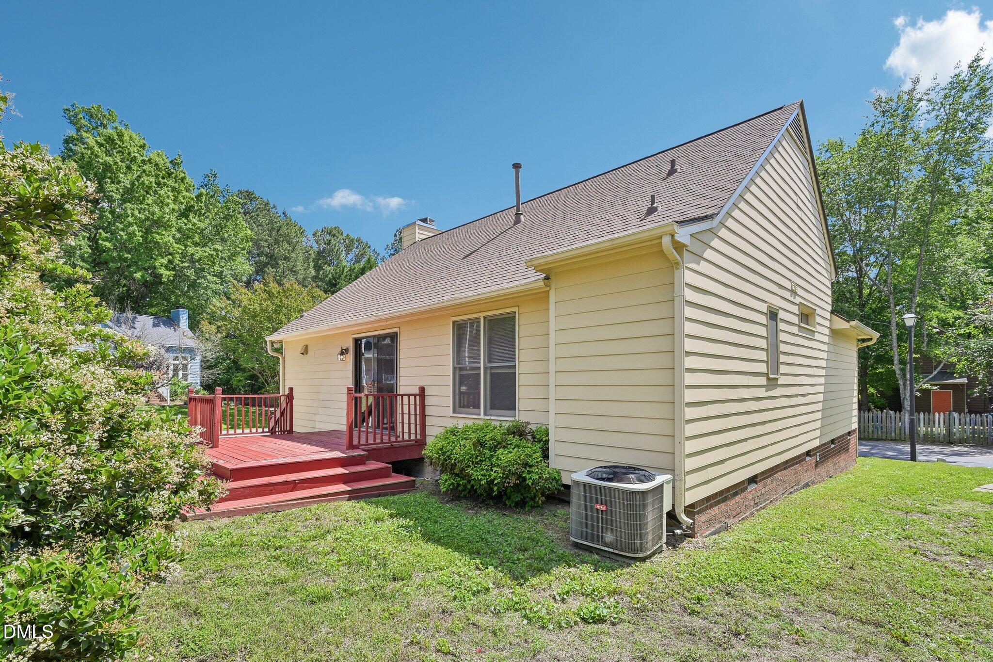 2800 West Jameson Road Raleigh, NC 27604 - Photo 24 of 24 a view of a house with backyard and a garden