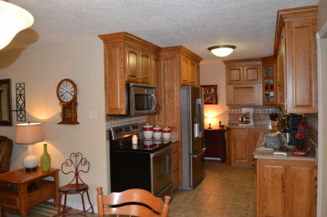 1890 Clydeton Road Waverly, TN 37185 - Photo 4 of 20 Kitchen has been remodeled with oak cabinets, stainless steel appliances, and silestone countertops