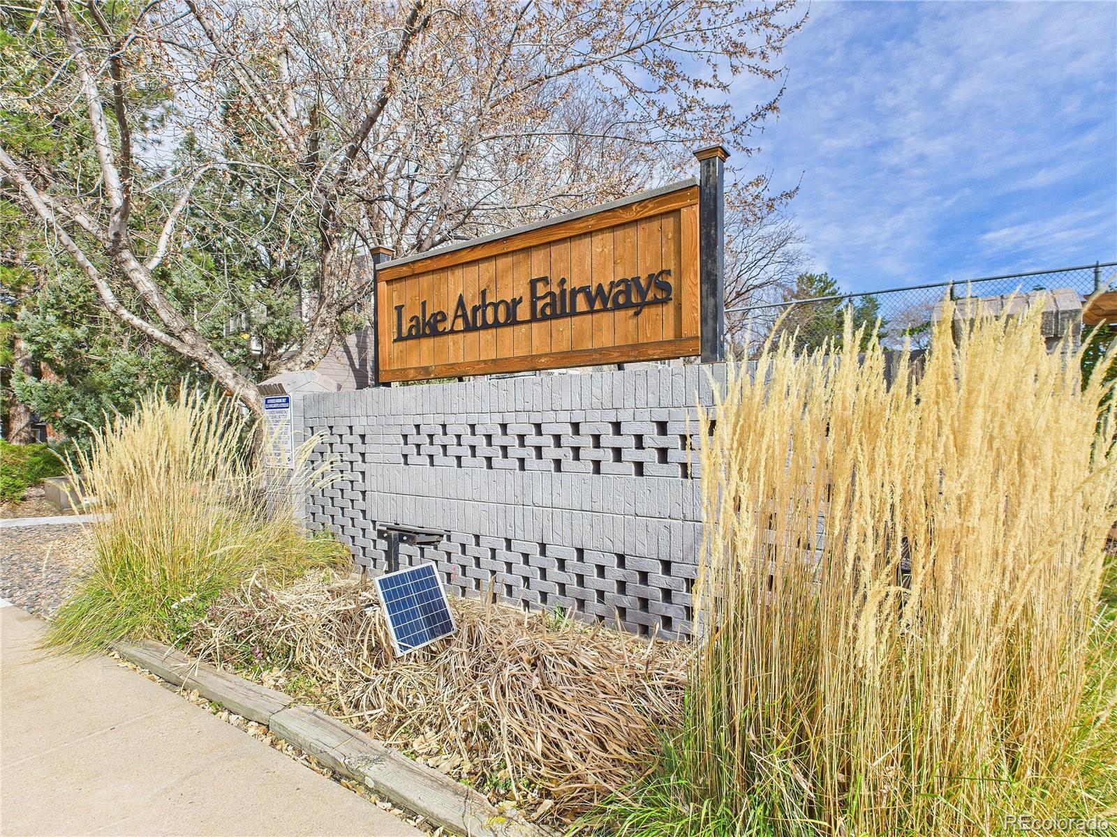 6725 West 84th Way, Unit 72 Arvada, CO 80003 - Photo 11 of 20 a sign on the wall of a building