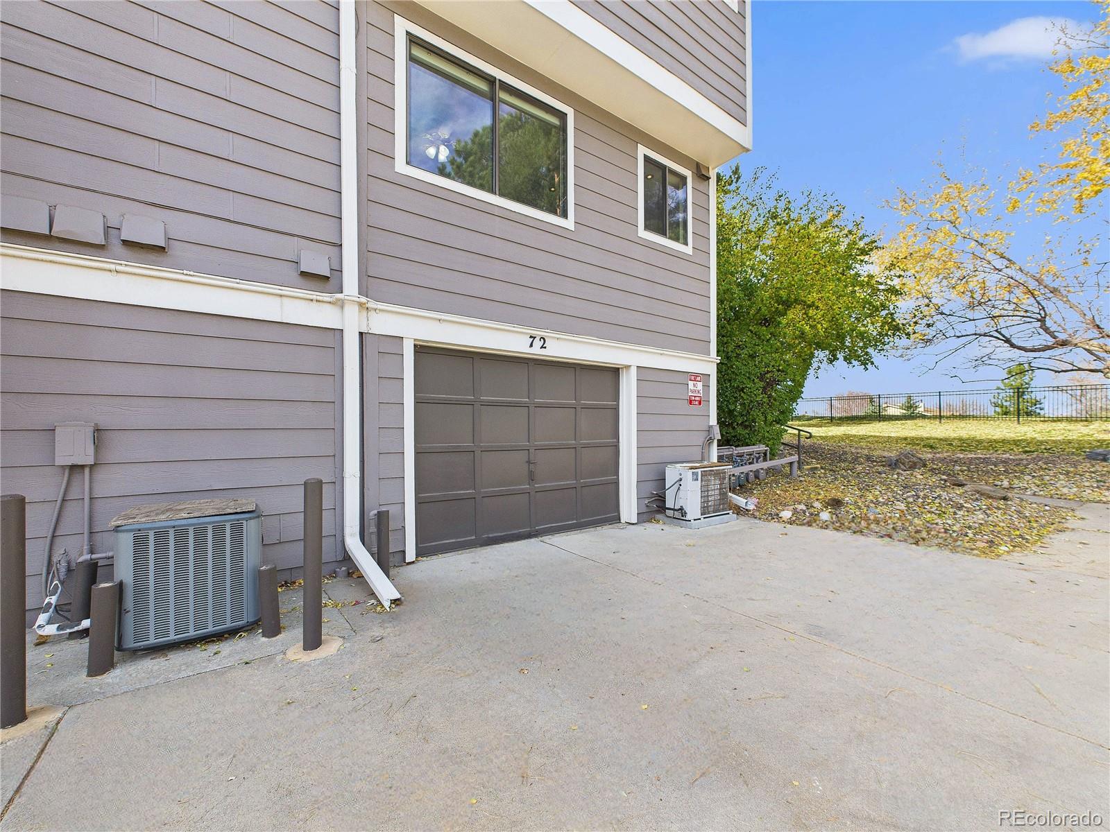 6725 West 84th Way, Unit 72 Arvada, CO 80003 - Photo 12 of 20 a view of a house with a garage