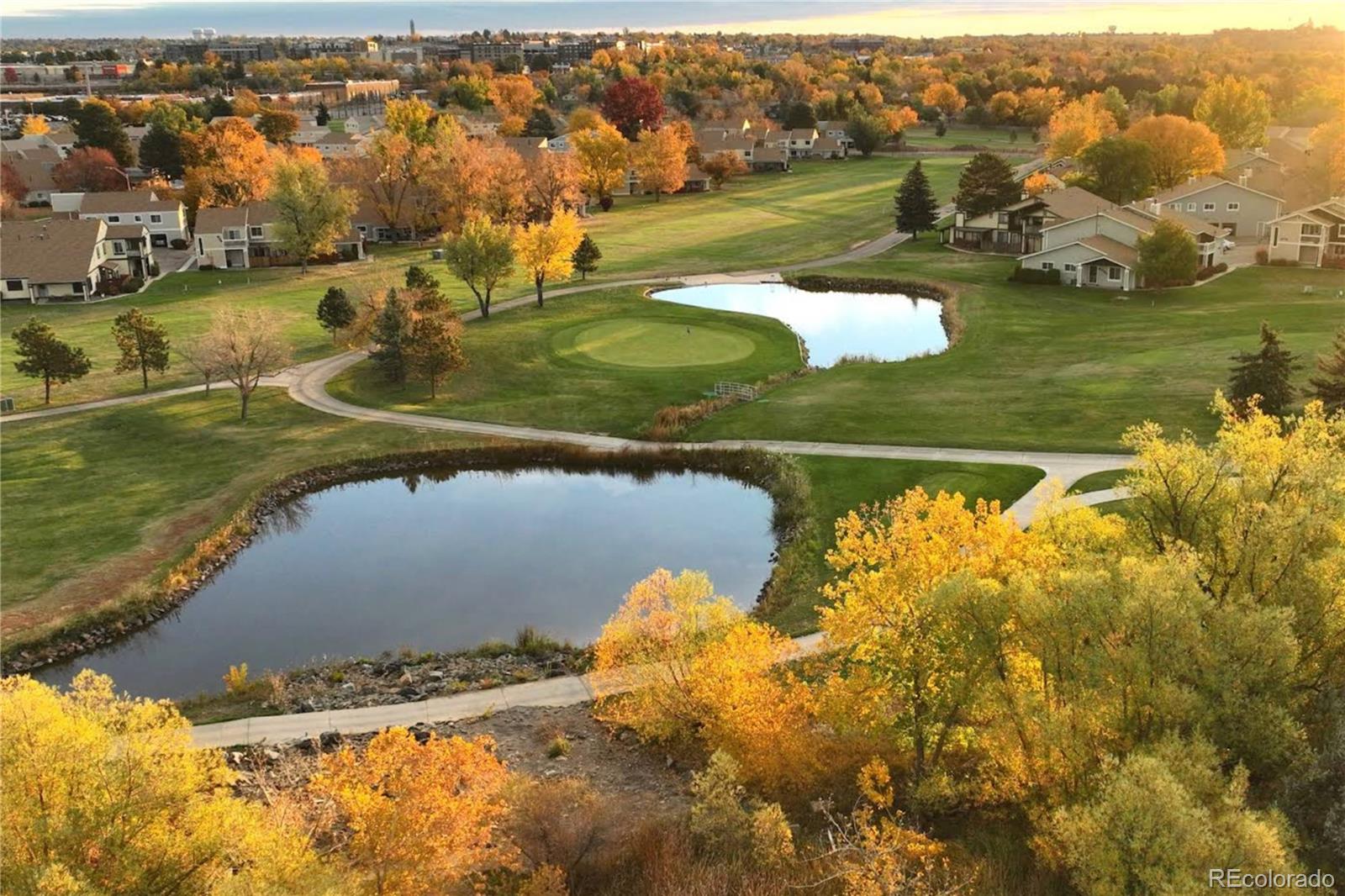 6725 West 84th Way, Unit 72 Arvada, CO 80003 - Photo 17 of 20 an aerial view of a house with a lake view