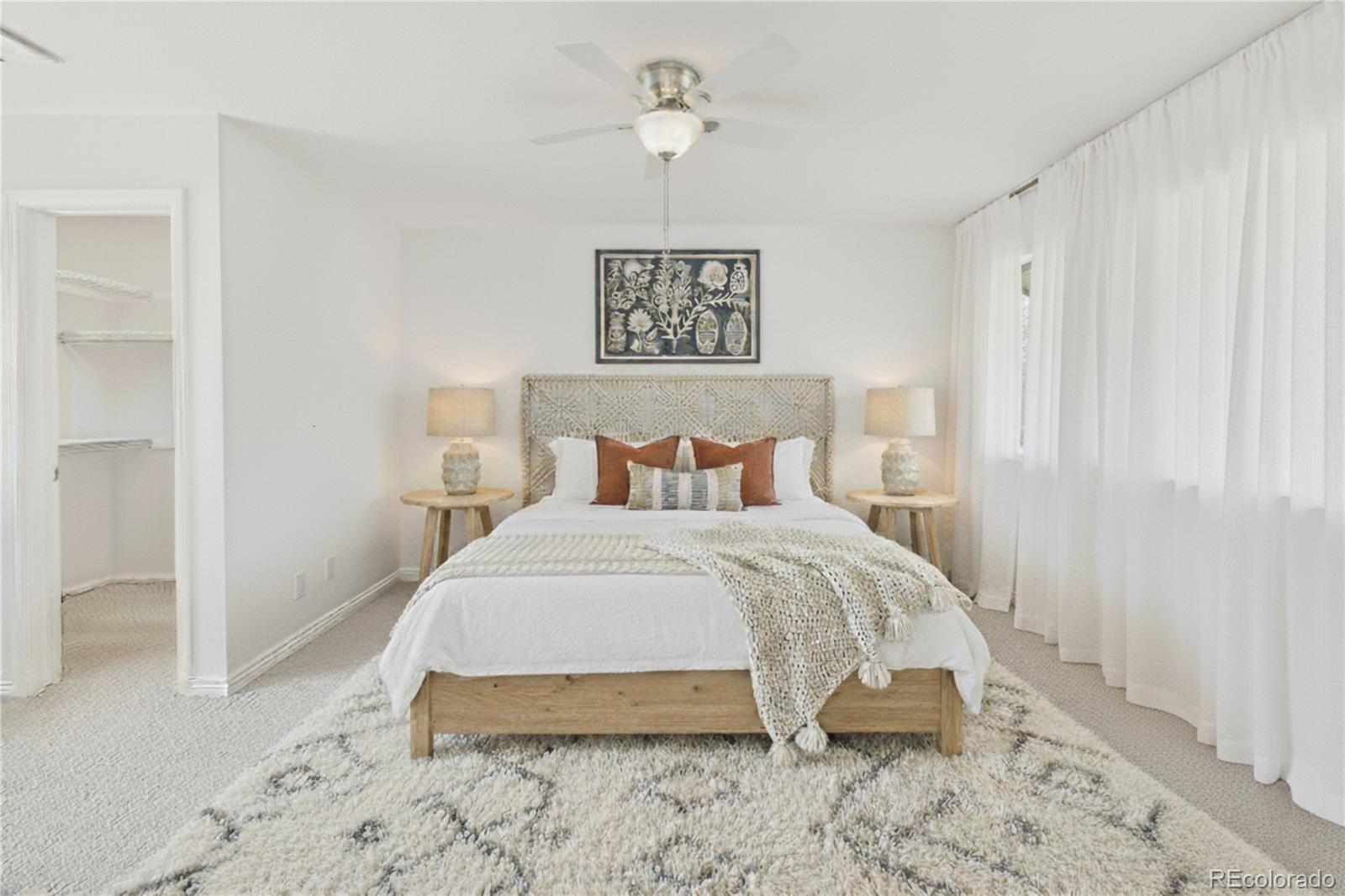 6725 West 84th Way, Unit 72 Arvada, CO 80003 - Photo 5 of 20 a bedroom with a bed and a table