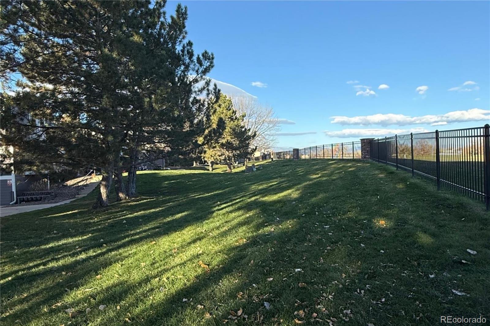 6725 West 84th Way, Unit 72 Arvada, CO 80003 - Photo 10 of 20 a view of a backyard