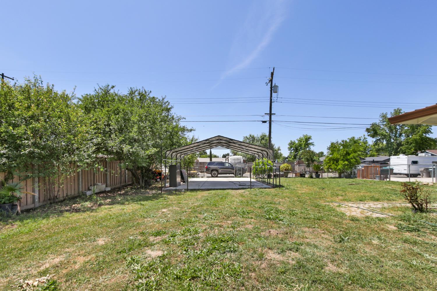 7208 7th Street Rio Linda, CA 95673 - Photo 37 of 41 a view of a house with a big yard and a large tree