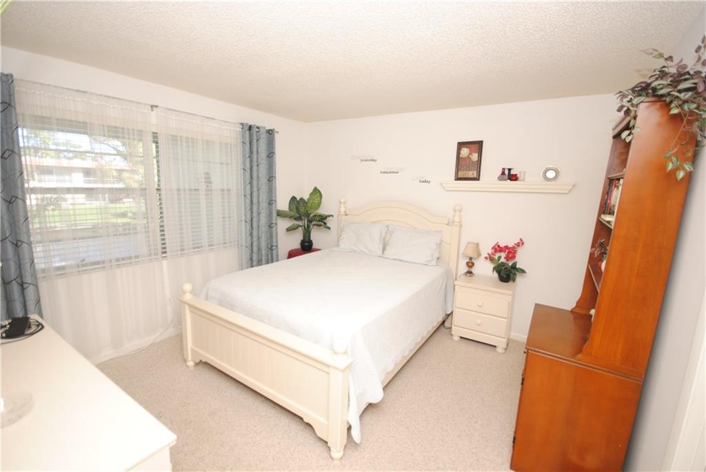 1997 Southwest Palm City Road, Unit I Stuart, FL 34994 - Photo 13 of 36 Master Bedroom with walk-in closet