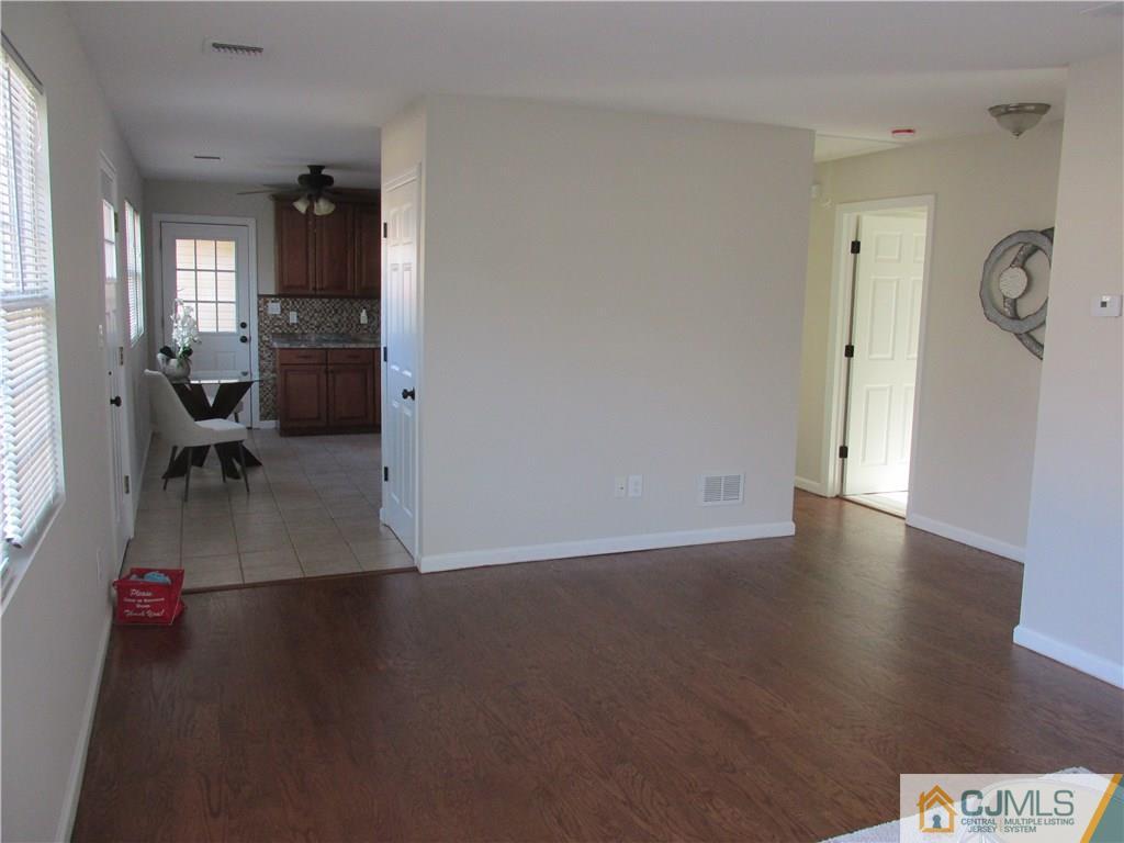111 Winthrop Road Edison, NJ 08817 - Photo 6 of 10 a view of livingroom and dining room with furniture wooden floor and windows