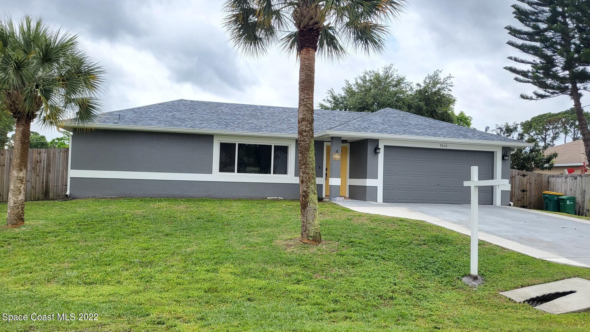 a front view of house with yard and porch