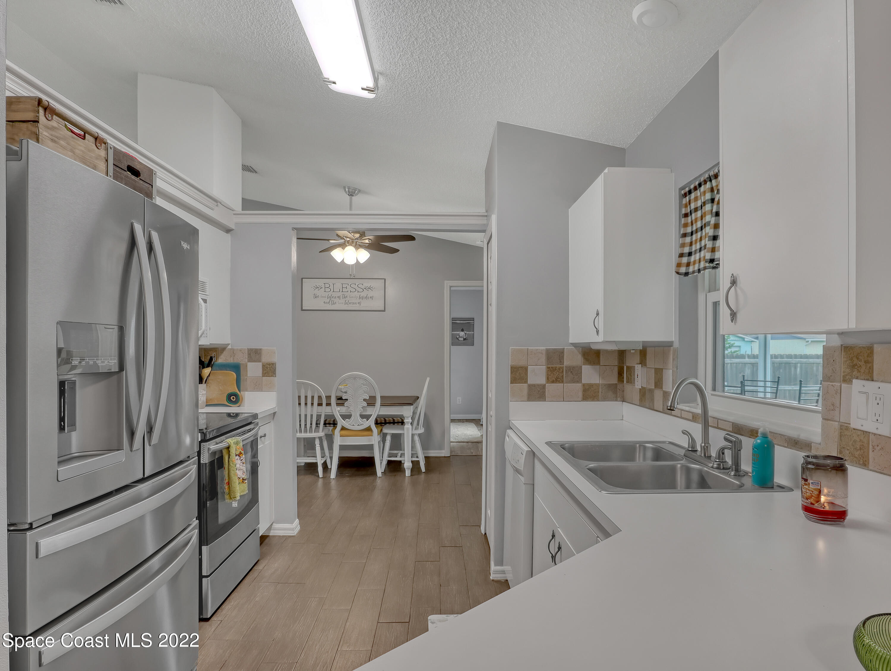 7010 Bayfront Road Cocoa, FL 32927 - Photo 10 of 36 KITCHEN OVERLOOKS FAMILY ROOM