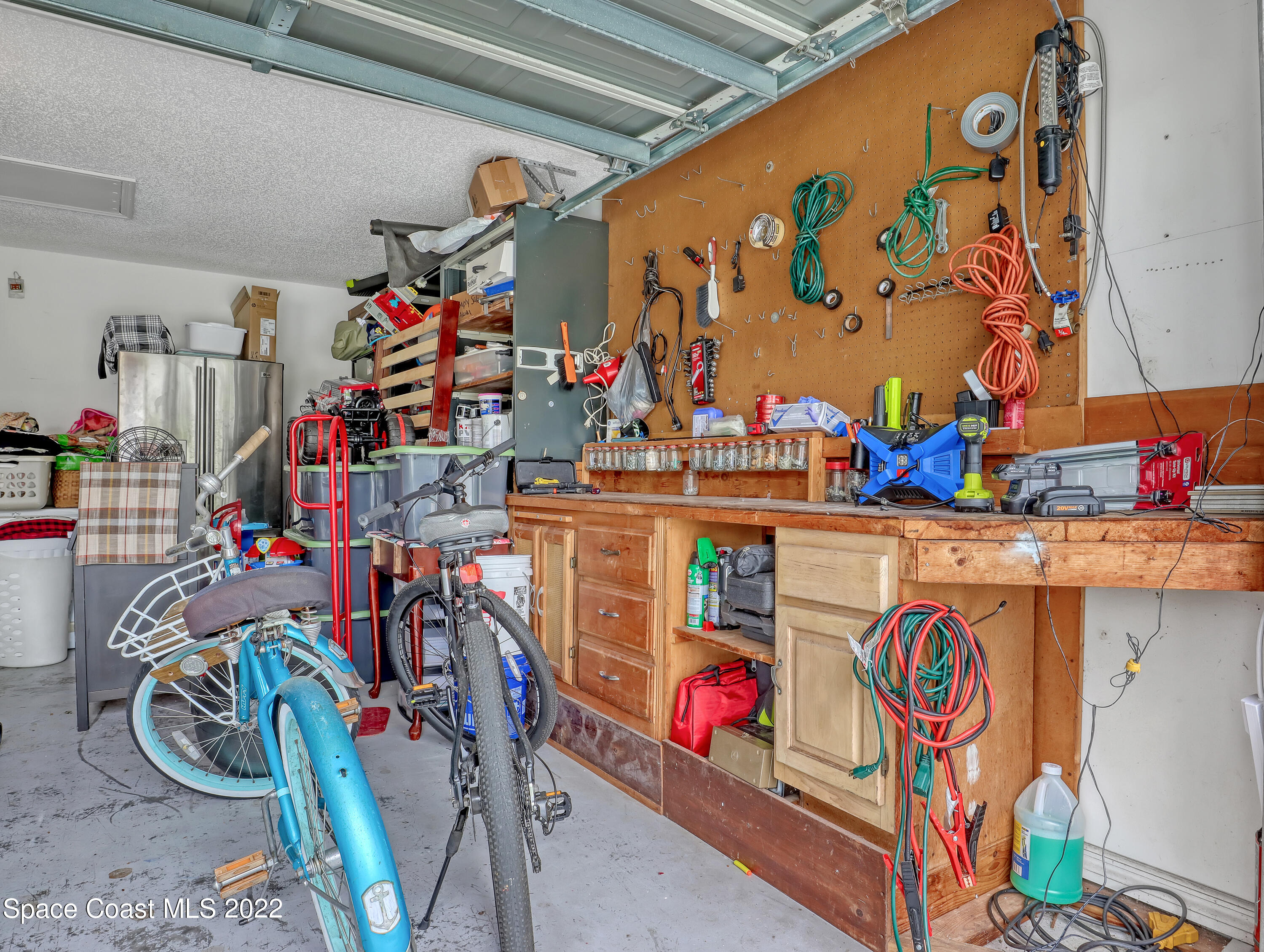 7010 Bayfront Road Cocoa, FL 32927 - Photo 23 of 36 WORK BENCH IN GARAGE