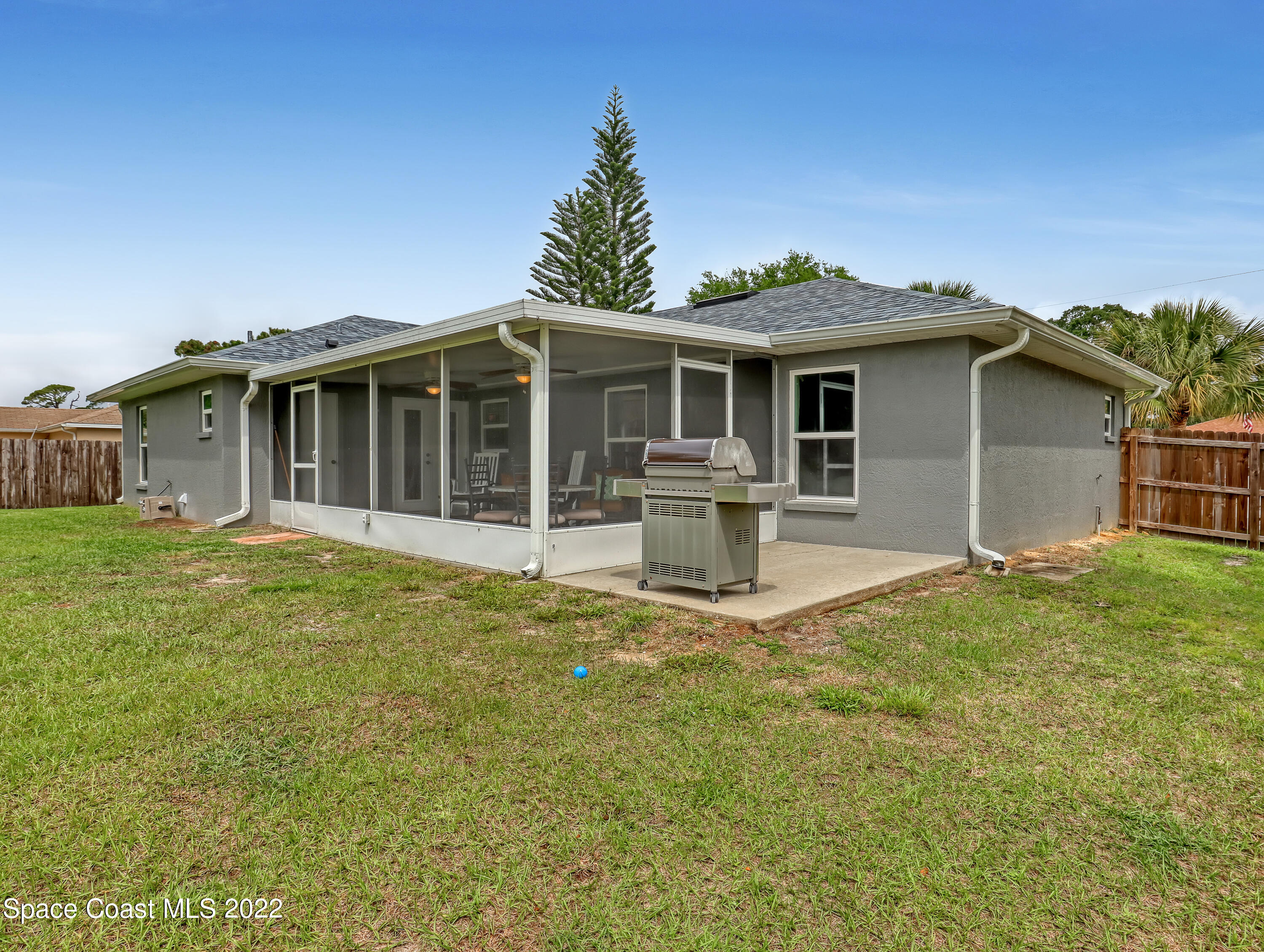 7010 Bayfront Road Cocoa, FL 32927 - Photo 27 of 36 a front view of a house with a yard