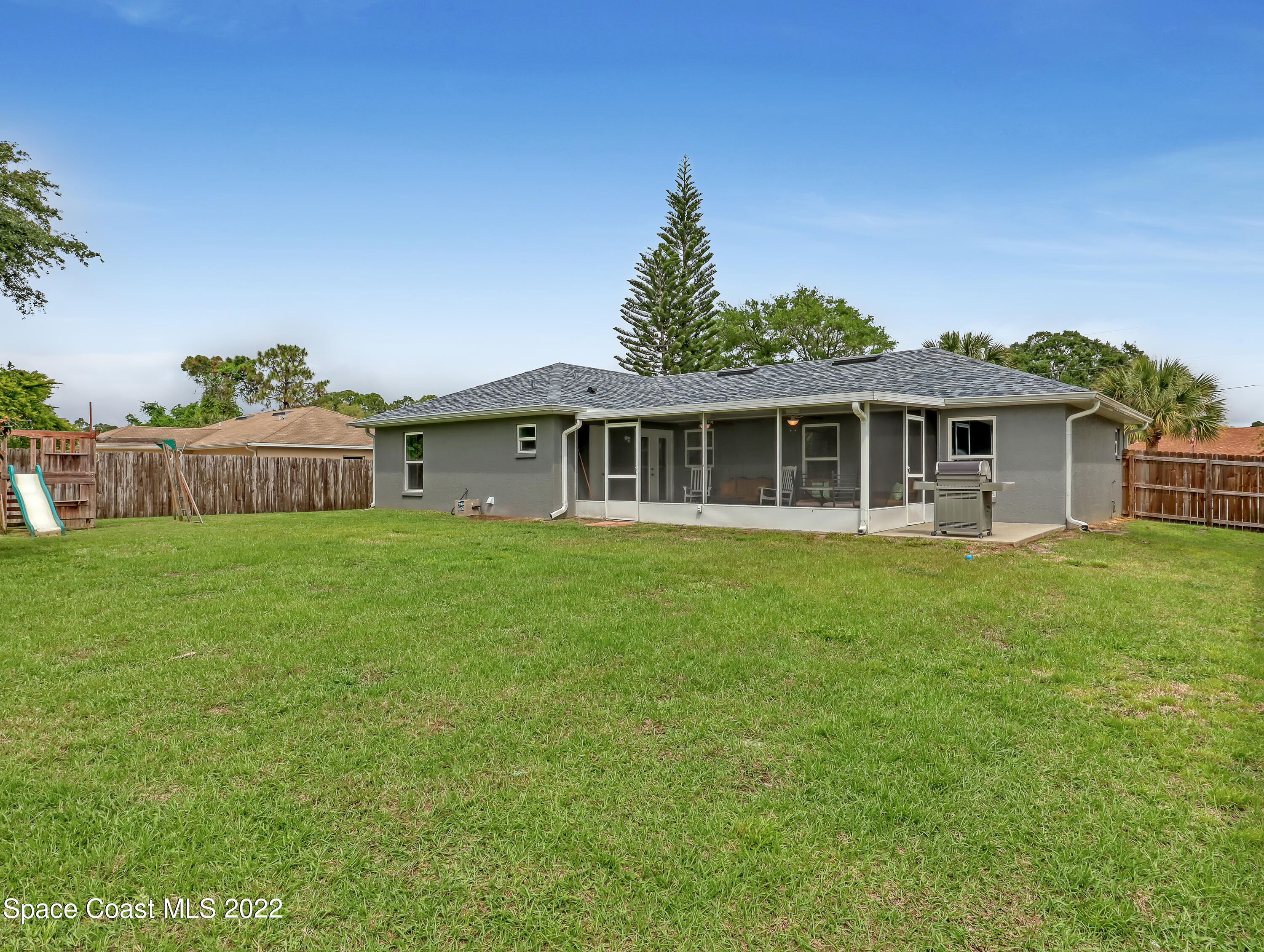 7010 Bayfront Road Cocoa, FL 32927 - Photo 28 of 36 a front view of a house with a garden