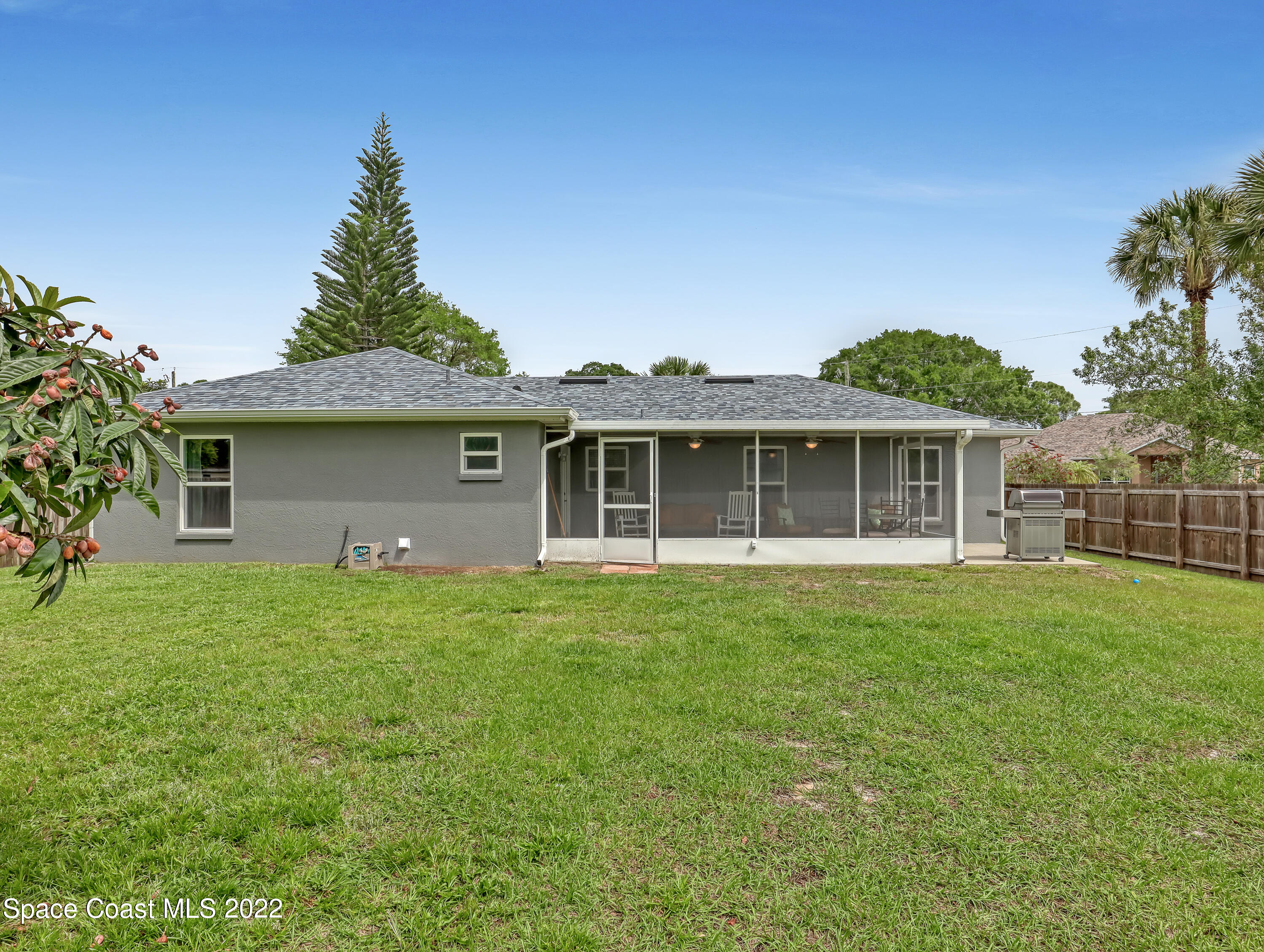7010 Bayfront Road Cocoa, FL 32927 - Photo 29 of 36 a front view of a house with a garden