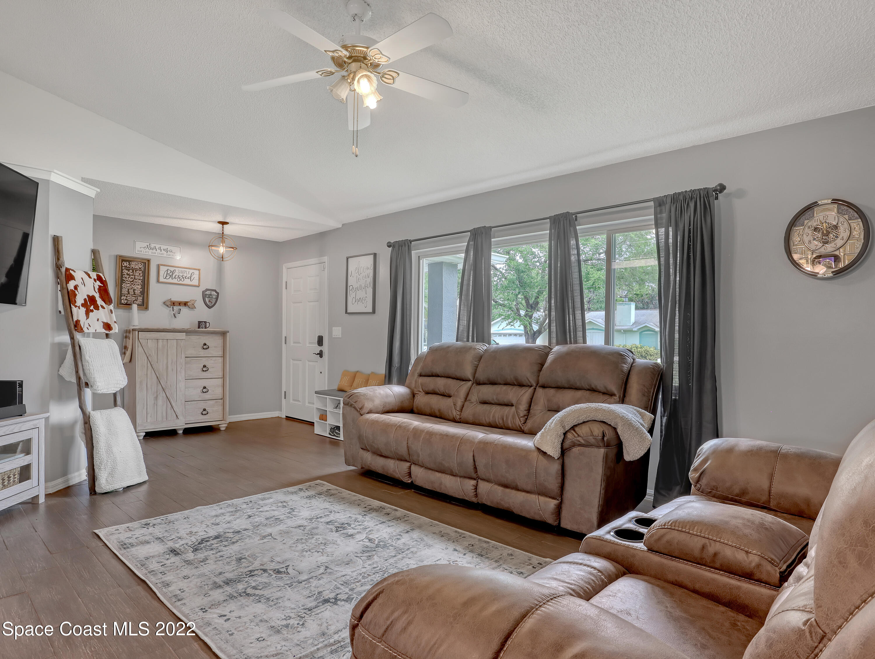 7010 Bayfront Road Cocoa, FL 32927 - Photo 6 of 36 a living room with furniture and a couch