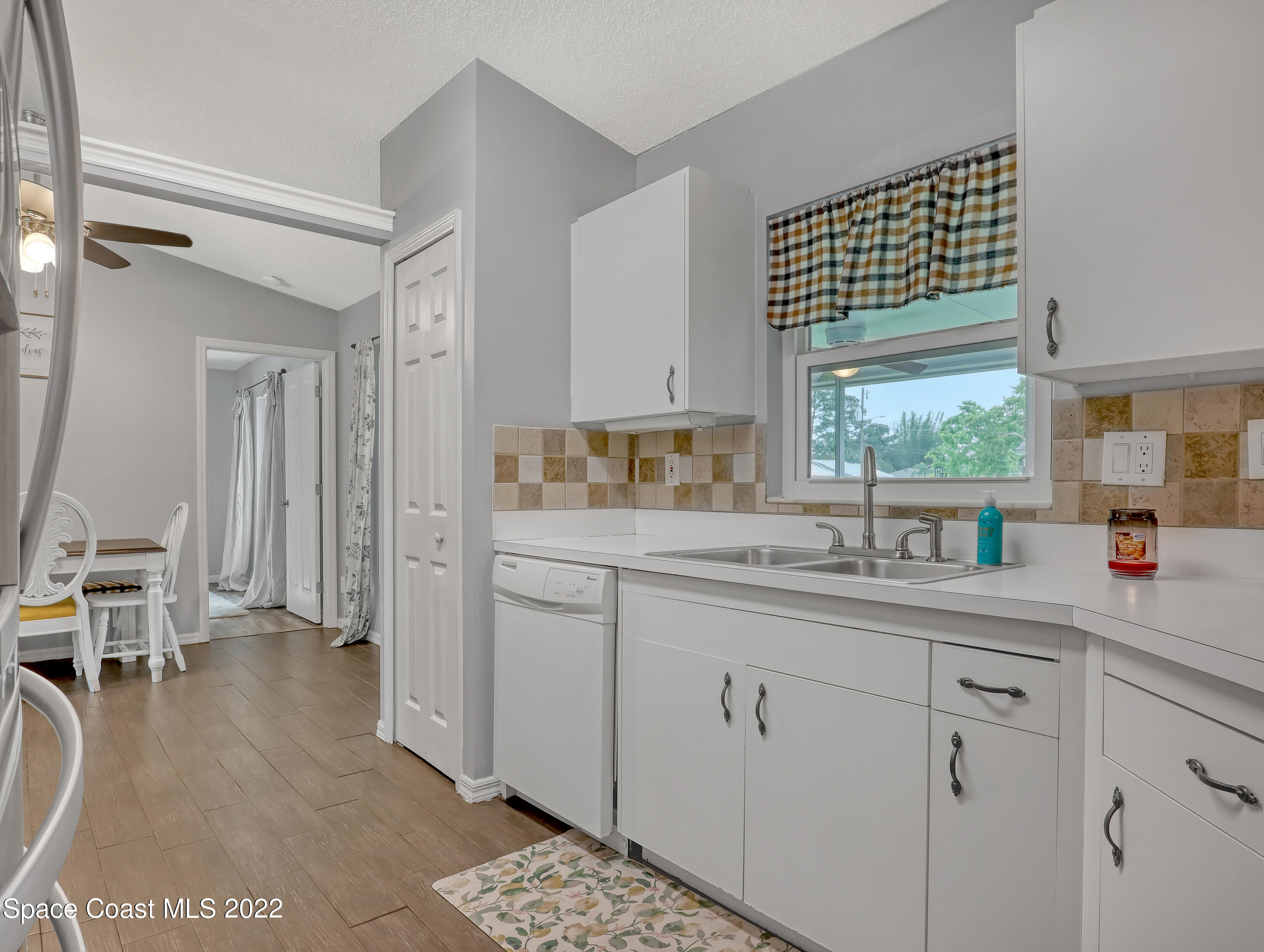 7010 Bayfront Road Cocoa, FL 32927 - Photo 36 of 36 a kitchen with a sink cabinets and window
